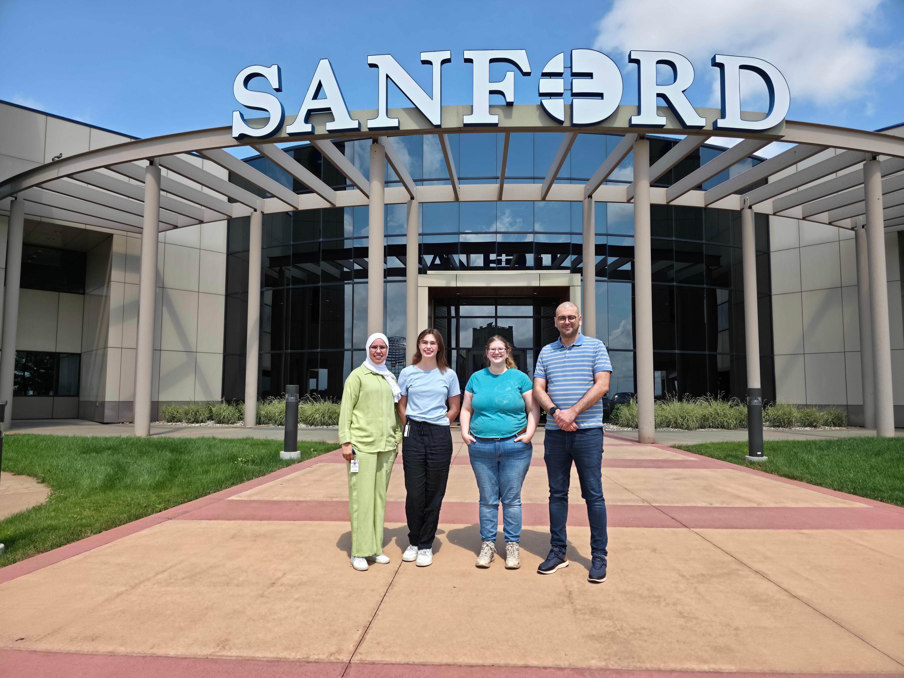 Loukil Lab team at Sanford entrance — 2026